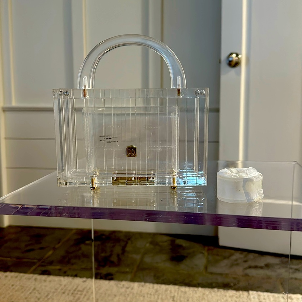 Acrylic clear ladies bag. Inside is genuine Chanel waist/fanny pack. Gold CC